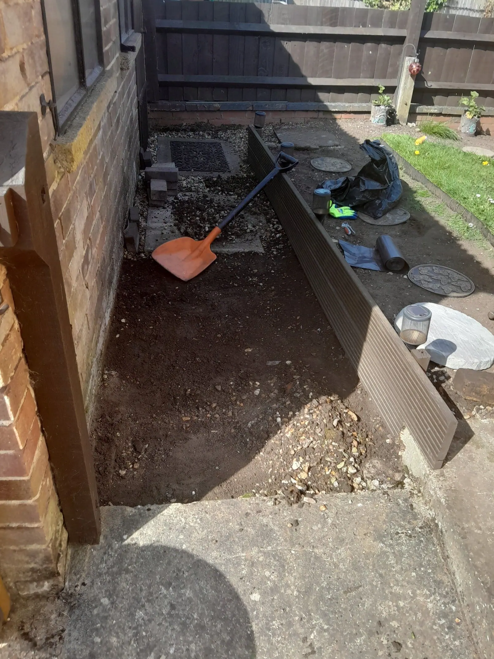 Side-return border dug out and edged ready for gravel and stepping stones